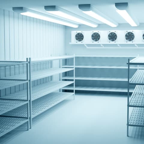 Refrigerators compartment. Warehouse with shelves for food storage. Grocery warehouse with air conditioning Freezing of products. Stelms with shelves. Refrigeration equipment. Industrial refrigerator.
