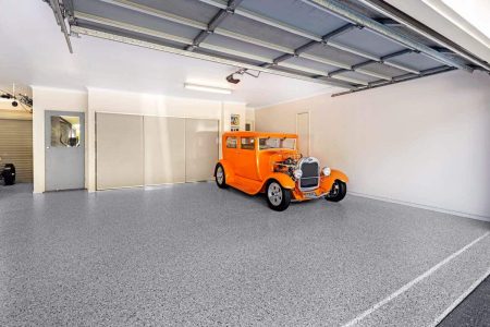 Orange hot rod parked on a Coolum Sands epoxy flake garage floor