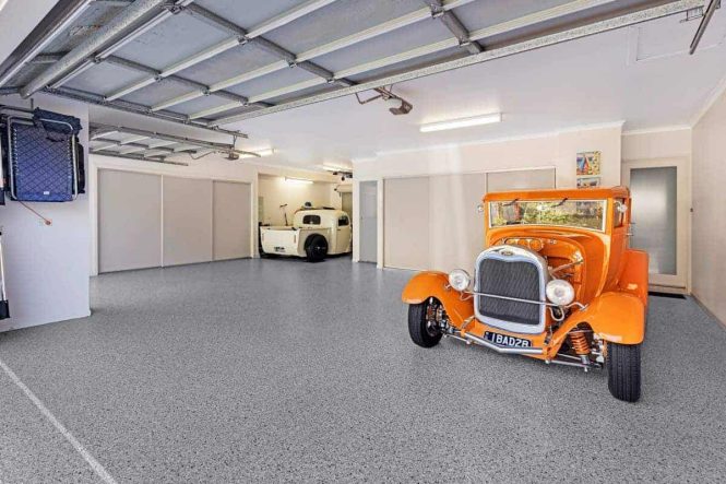 Front view of an orange hot rod on Coolum Sands epoxy flake garage flooring