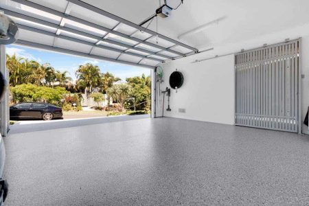 Open garage door with Hastings epoxy flake flooring inside