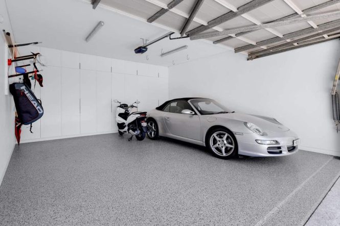 Silver Porsche and scooter in a garage with Hastings epoxy flake flooring
