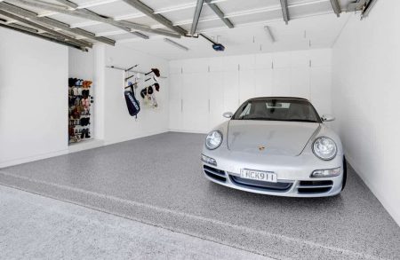 Close up of a silver Porsche on Hastings epoxy flake flooring