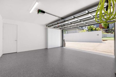 Inside a garage with Nero Grey epoxy flake flooring