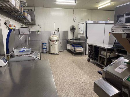 Commercial bakery prep area with epoxy flake flooring