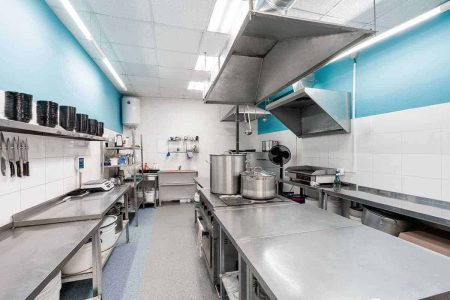 Stainless steel commercial kitchen with an easy clean floor