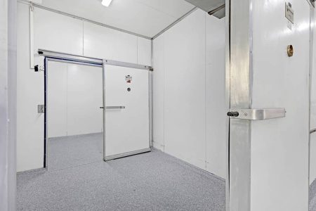 Coolroom with grey epoxy flooring and sliding door