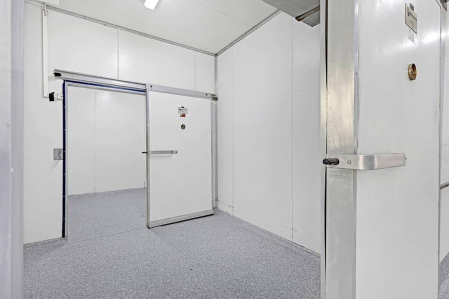 Coolroom with grey epoxy flooring and sliding door