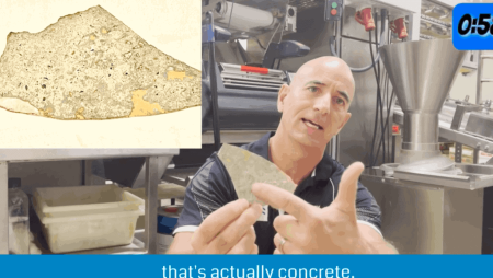 Peeled epoxy coating sample with concrete still bonded underneath