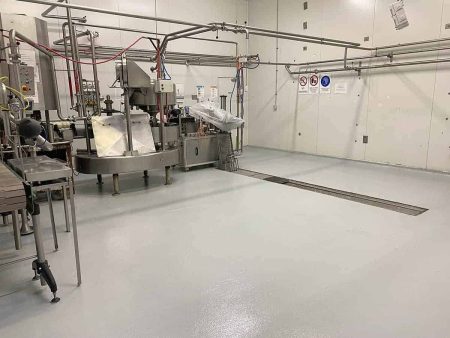 Food production plant with seamless epoxy flooring and a floor drain