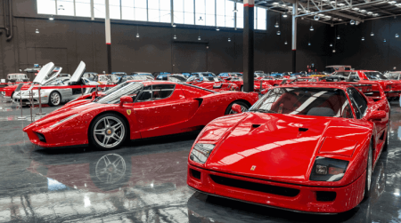 Red Ferraris on a glossy epoxy floor at the Gosford car collection