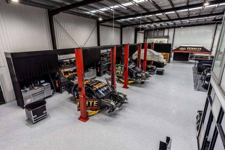Race car workshop with epoxy flake flooring and car hoists