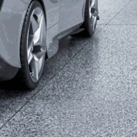 Car wheel on a full flake seamless epoxy floor