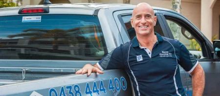Epoxy Flooring Co team member leaning on the company ute