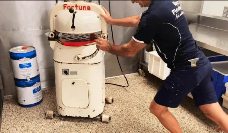 Moving a heavy bakery machine across epoxy flake flooring