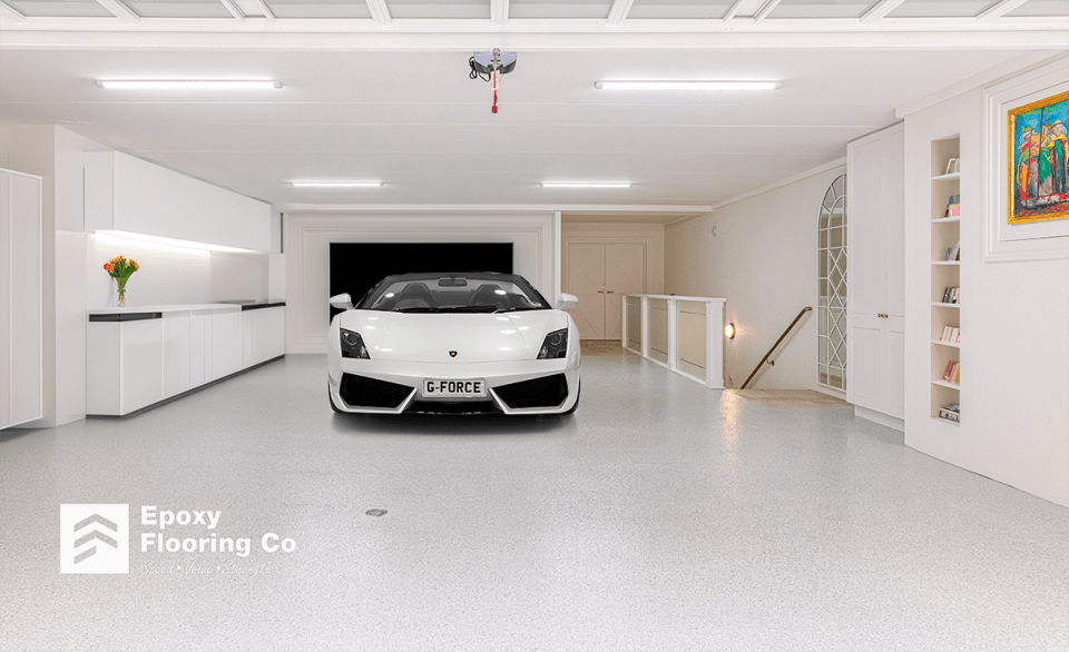 Car on a freshly installed epoxy flake flooring by Epoxy Flooring Co.