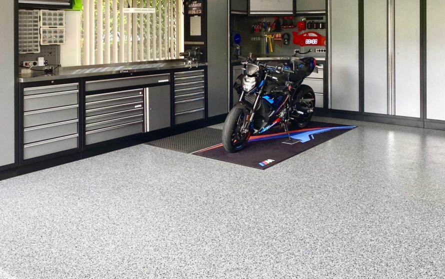 BMW motorbike in a garage with Nero Grey epoxy flake flooring